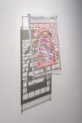 A framed piece of artwork with a brick pattern and a brick window.